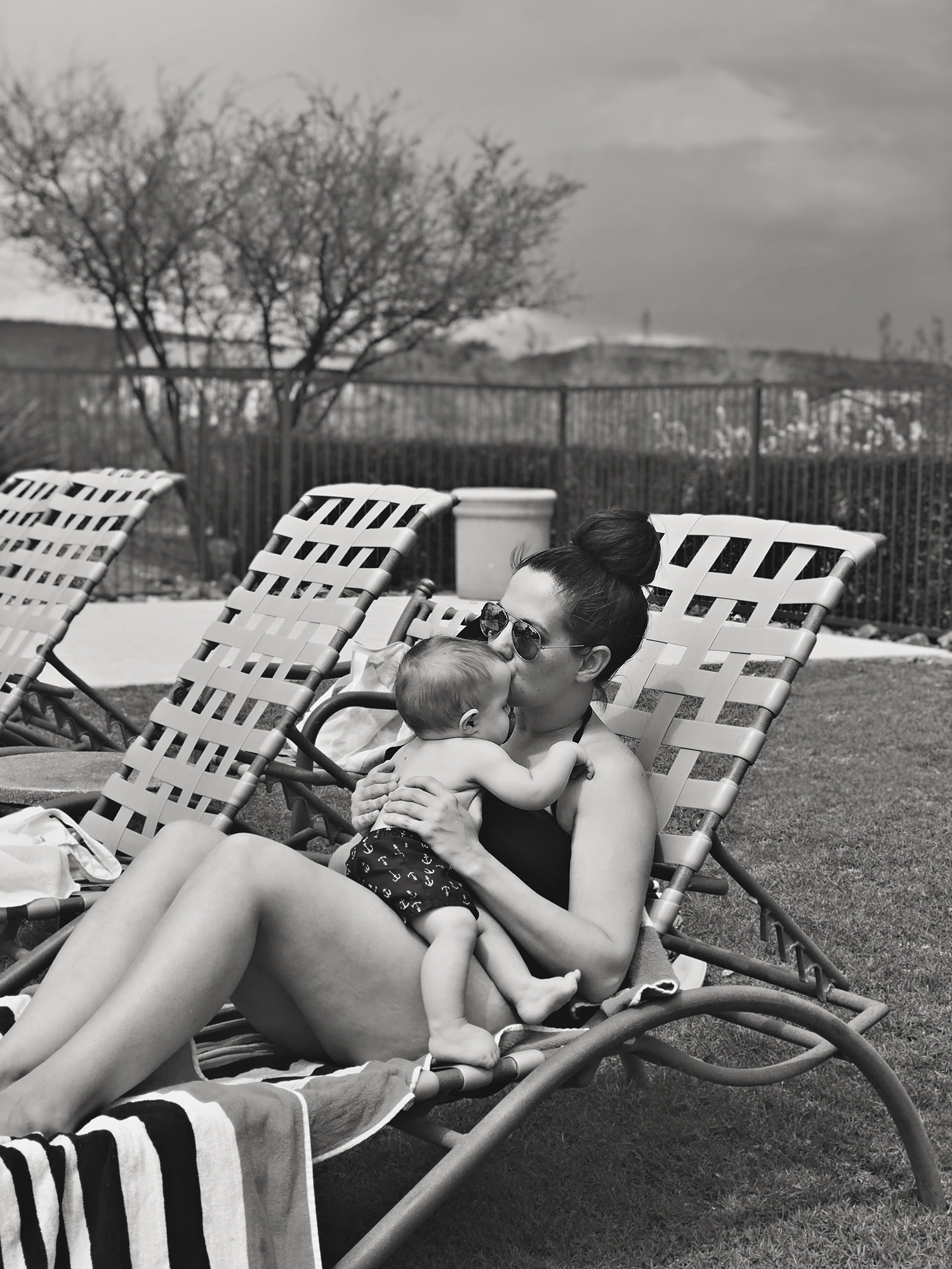 Pool days in the Arizona desert. A black and white collection of beating the triple degree heat and enjoying time with as a family. Desert living during the summer months at it's finest! #BlackAndWhitePhotography #Arizona #Phoenix #Poolside