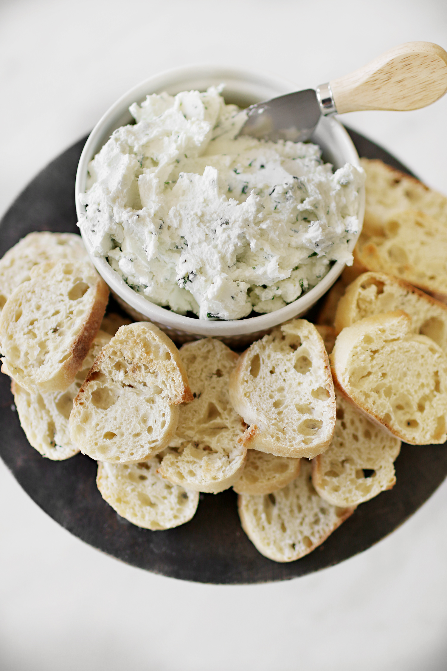 Goat Cheese and Herb Spread Appetizer. The perfect touch to entertaining guests this holiday season and one that will be a crowd pleaser! Catch the entire recipe and how-to over at Haus of Layne #EasyAppetizers #AppetizerRecipe #HolidayRecipes #EasyHolidayRecipes #HolidayAppetizerRecipe