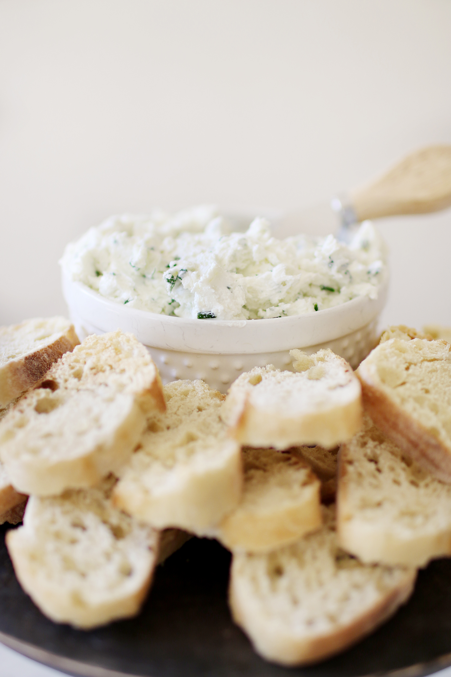 An easy appetizer: Goat Cheese and Herb Spread. The perfect touch to entertaining guests this holiday season and one that will be a crowd pleaser! Catch the entire recipe and how-to over at Haus of Layne #EasyAppetizers #AppetizerRecipe #HolidayRecipes #EasyHolidayRecipes #HolidayAppetizerRecipe