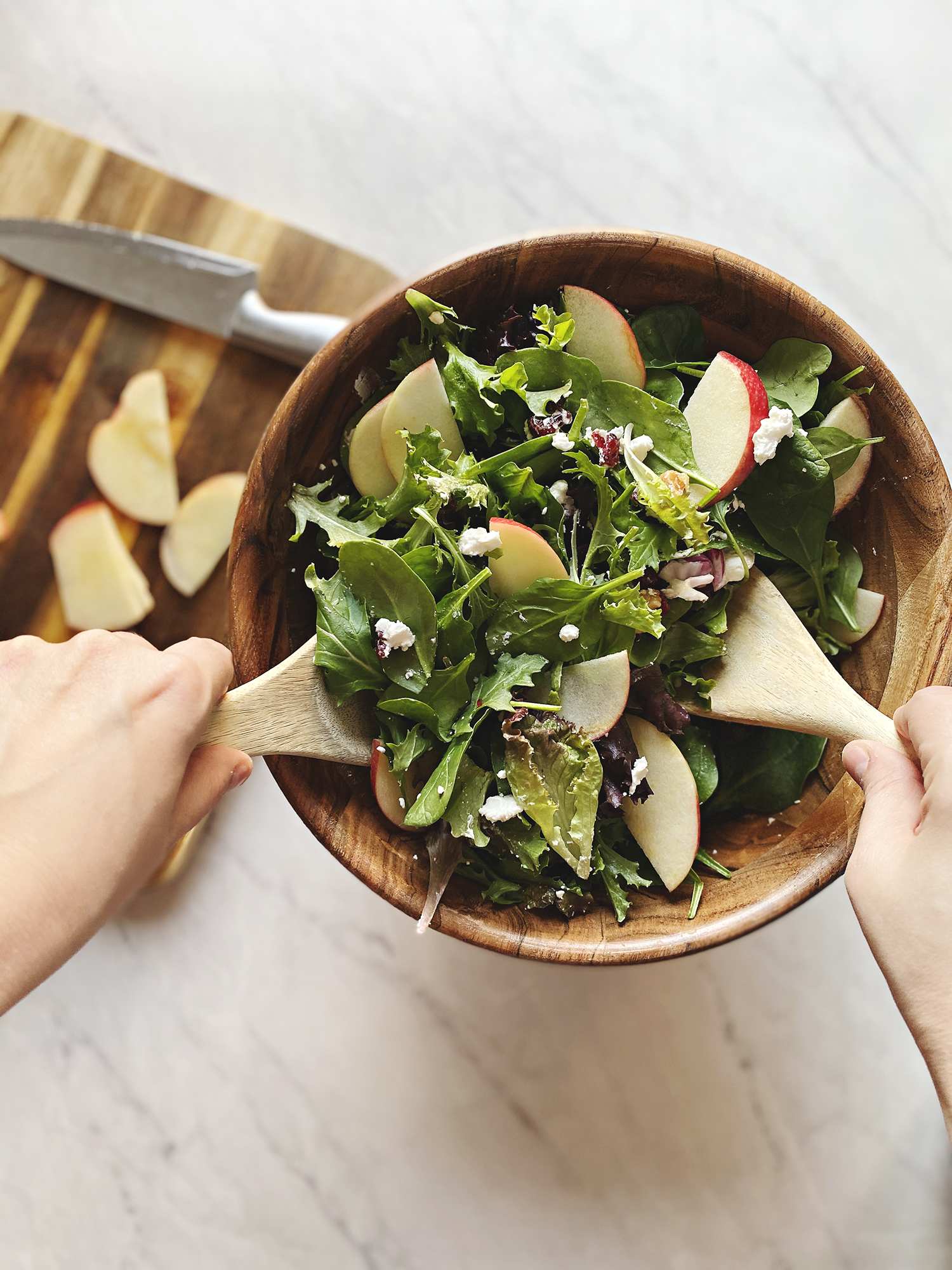 A delicious apple and walnut salad, perfect for the winter months. Easily thrown together and a favorite to add alongside your dinners. Get the full recipe on Haus of Layne! #Recipe #Salad #WinterSalad #Walnut #Cranberry #Apple #SaladRecipe #FreshRecipe