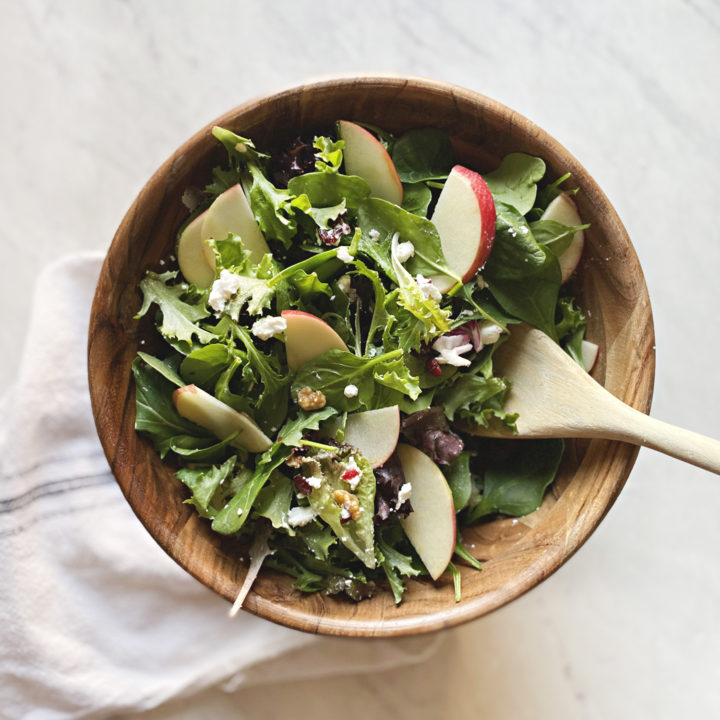 A delicious apple and walnut salad, perfect for the winter months. Easily thrown together and a favorite to add alongside your dinners. Get the full recipe on Haus of Layne! #Recipe #Salad #WinterSalad #Walnut #Cranberry #Apple #SaladRecipe #FreshRecipe