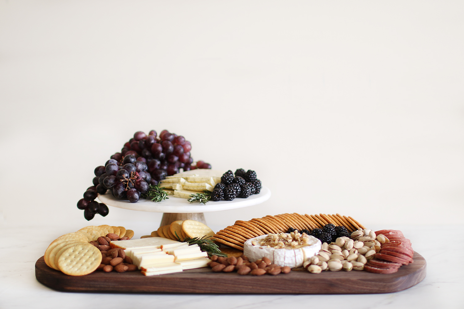 How to make a simple and beautiful charcuterie board. Get all of the ins and outs and how to wow those you are entertaining over at Haus of Layne! #CharcuterieBoard #HowToMakeACharcuterieBoard #BeautifulCharcuterieBoard #SimpleCharcuterieBoard #HowToMakeACheeseBoard #EntertainingTips #PartyIdeas #AppetizerRecipe #EasyAppetizerIdeas