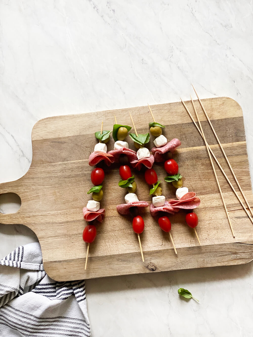 Antipasto skewers and an easy appetizer for those summer gatherings! Light, fresh, and delicious. Catch them over on KaraLayne.com