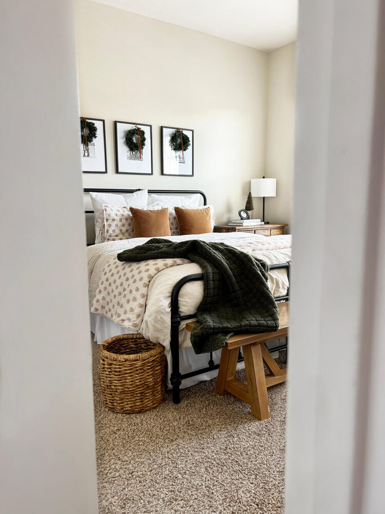 A simple and cozy modern cottage bedroom designed with classic touches and hints of the holiday season. I'm sharing a peek into this bedroom redo as well as a few simple ways you can create warm and inviting space perfect for the winter season. Dive in at KaraLayne.com!