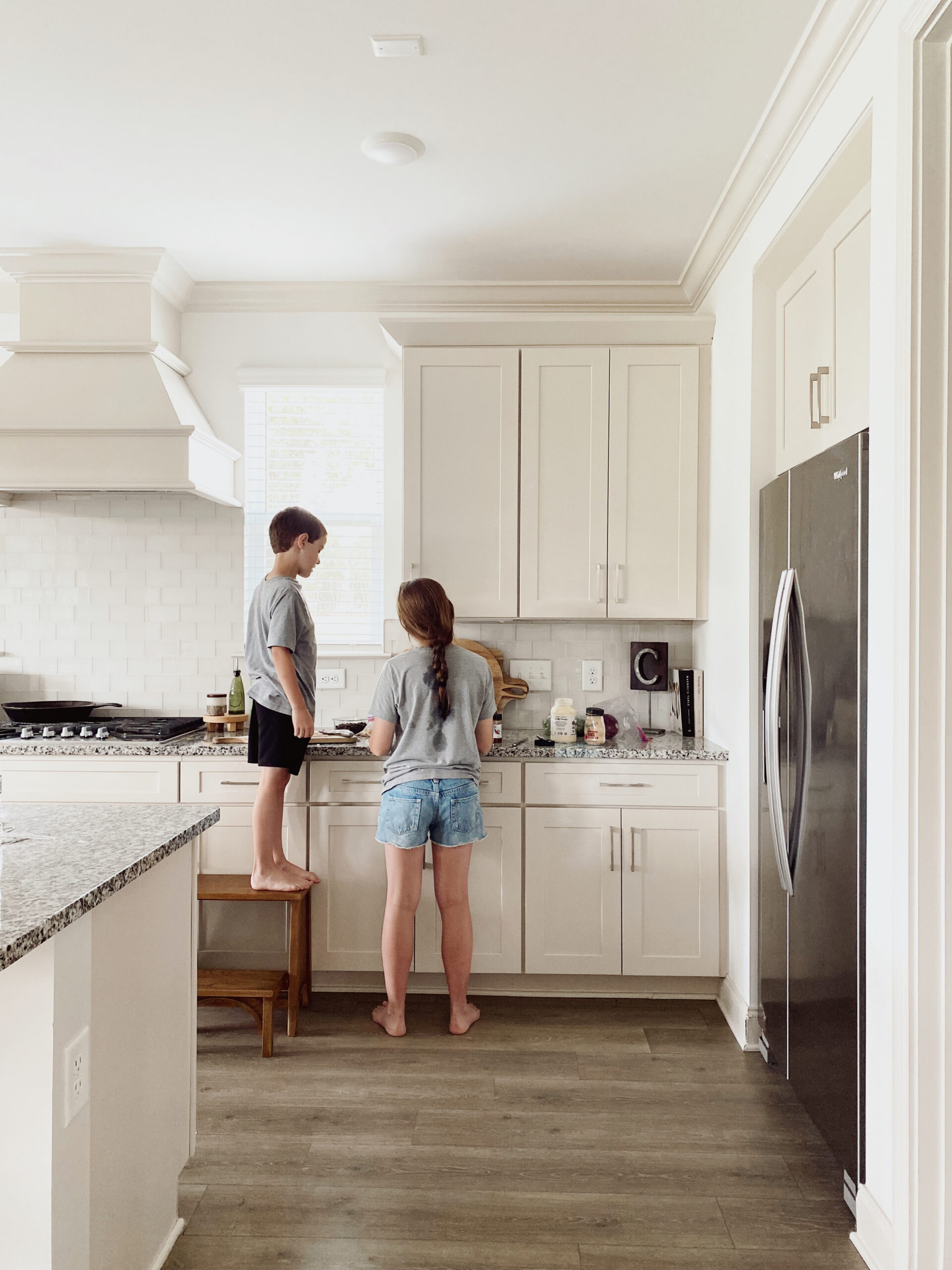 Kara Layne making Southwest chicken salad with her kids in their kitchen during a relaxed afternoon at home.